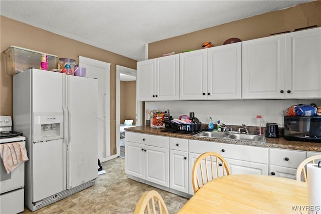 417 18th St, Niagara Falls, NY 14303 - kitchen with white appliances, a sink, and white cabinetry