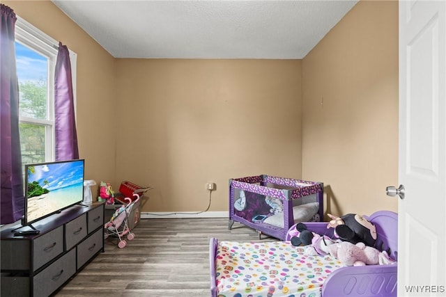 417 18th St, Niagara Falls, NY 14303 - bedroom featuring wood finished floors and baseboards