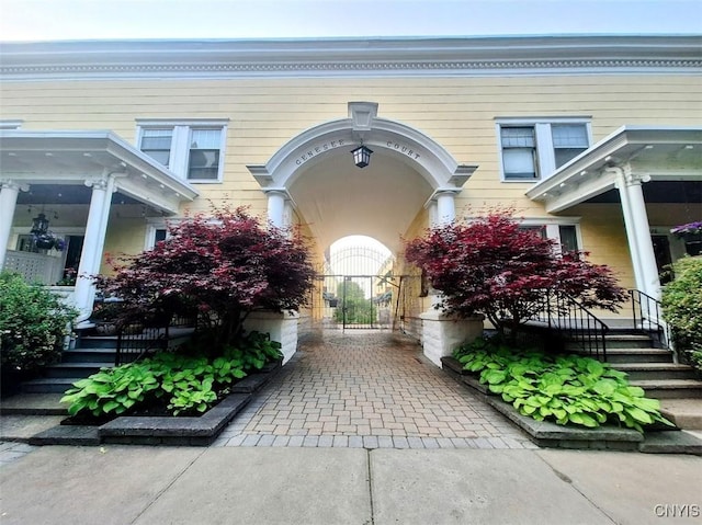 7 Genesee Ct, Utica, NY 13502 - doorway to property with covered porch and a gate