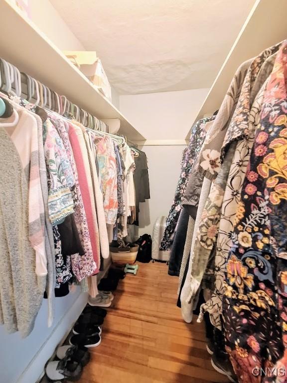 7 Genesee Ct, Utica, NY 13502 - walk in closet with wood finished floors