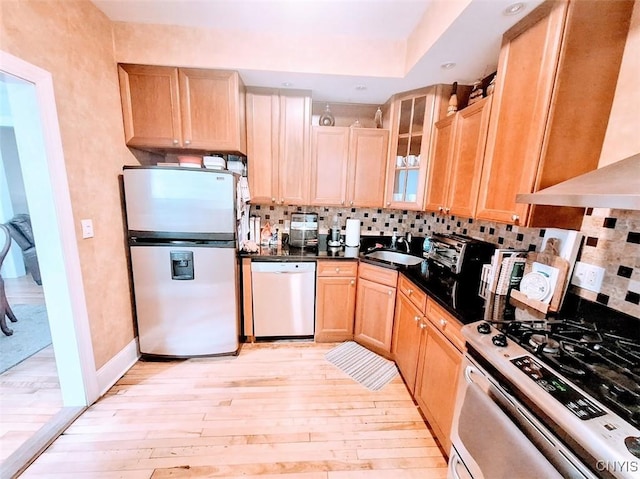 7 Genesee Ct, Utica, NY 13502 - kitchen with freestanding refrigerator, dishwashing machine, gas range, a sink, and light brown cabinetry