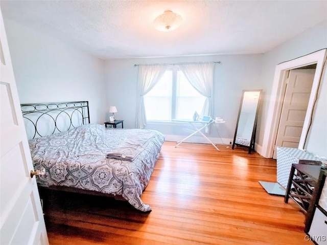 7 Genesee Ct, Utica, NY 13502 - bedroom with light wood-type flooring and baseboards