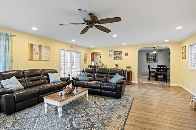 193 Floral Dr, Irondequoit, NY 14617 - living room with arched walkways, ceiling fan, wood finished floors, recessed lighting, and baseboards