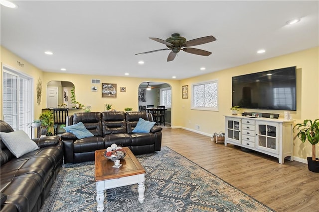 193 Floral Dr, Irondequoit, NY 14617 - living room featuring arched walkways, ceiling fan, wood finished floors, baseboards, and recessed lighting