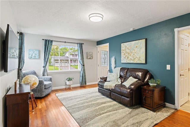193 Floral Dr, Irondequoit, NY 14617 - living room featuring wood finished floors and baseboards