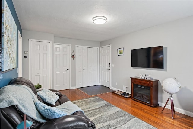 193 Floral Dr, Irondequoit, NY 14617 - living room featuring wood finished floors and baseboards