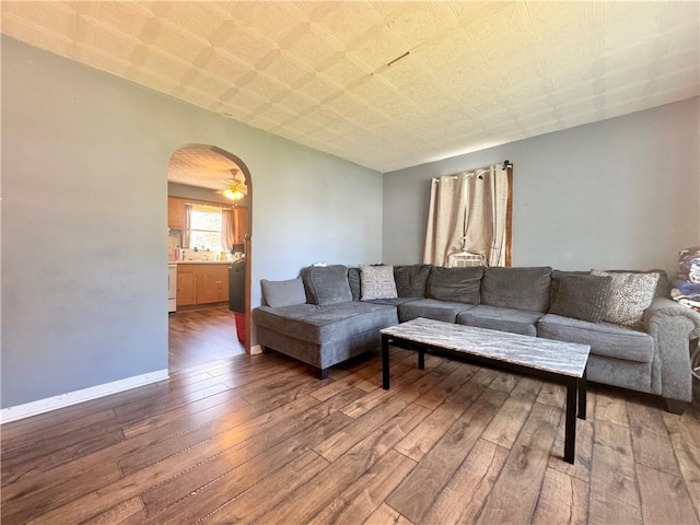 341 Grant St, Elmira-City, NY 14901 - living room featuring hardwood / wood-style floors, arched walkways, and baseboards