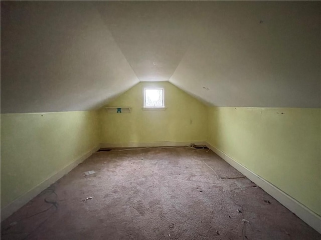 6235 E Avon Lima Rd, Avon, NY 14414 - bonus room with lofted ceiling, carpet flooring, and baseboards