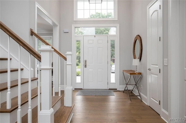 520 Paradise Rd, Amherst, NY 14051 - entrance foyer with a towering ceiling, wood finished floors, and stairs