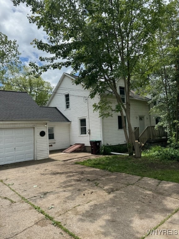 3649 Southwestern Blvd, Orchard Park, NY 14127 - view of property exterior with driveway and a garage