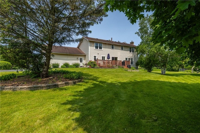 6 Barben Cir, Mendon, NY 14506 - back of house featuring a chimney, a yard, and a deck