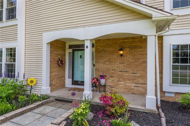 6 Barben Cir, Mendon, NY 14506 - property entrance with brick siding and covered porch
