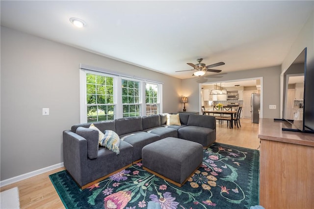 6 Barben Cir, Mendon, NY 14506 - living area featuring a ceiling fan, light wood-type flooring, and baseboards