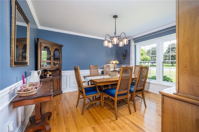 6 Barben Cir, Mendon, NY 14506 - dining room with ornamental molding, light wood-style flooring, a chandelier, wainscoting, and a decorative wall