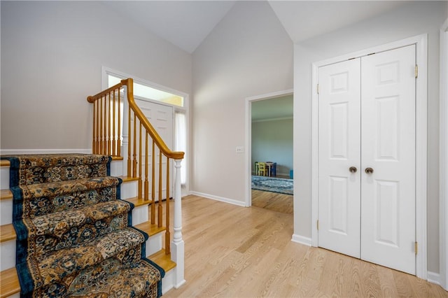 6 Barben Cir, Mendon, NY 14506 - staircase featuring wood finished floors, vaulted ceiling, and baseboards
