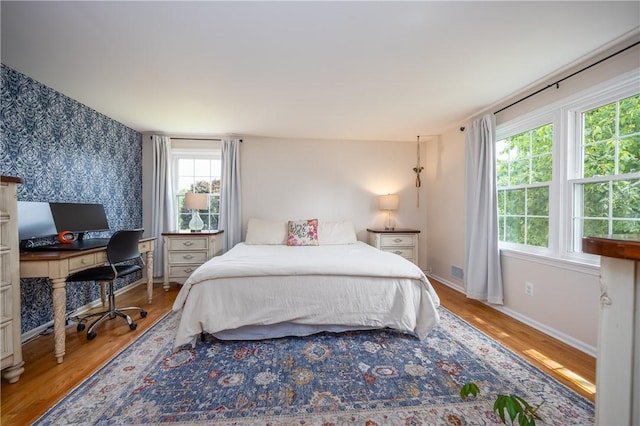 6 Barben Cir, Mendon, NY 14506 - bedroom with wood finished floors, multiple windows, baseboards, and wallpapered walls