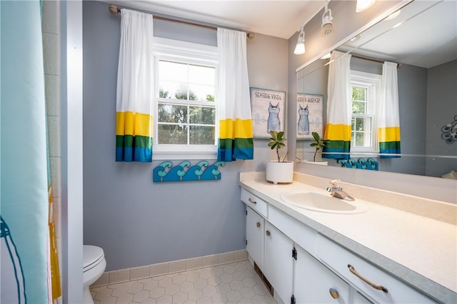 6 Barben Cir, Mendon, NY 14506 - full bathroom with vanity, toilet, tile patterned floors, and baseboards