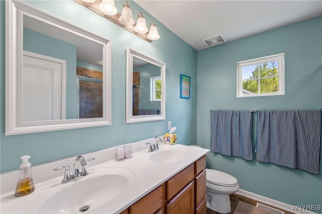 1 Skylark Ln, Wheatfield, NY 14304 - bathroom featuring double vanity, a tile shower, and toilet