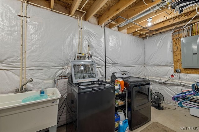 1 Skylark Ln, Wheatfield, NY 14304 - unfinished below grade area featuring washing machine and clothes dryer, electric panel, and a sink