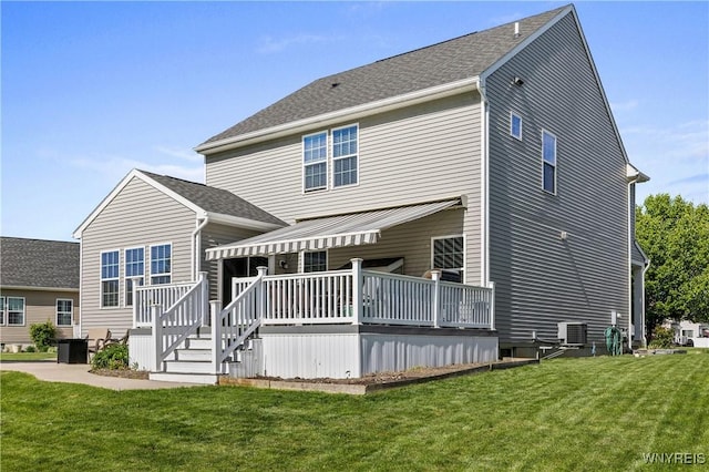 1 Skylark Ln, Wheatfield, NY 14304 - rear view of property featuring a deck, a lawn, and central AC