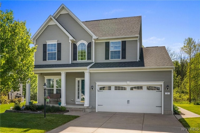 1 Skylark Ln, Wheatfield, NY 14304 - view of front of house with covered porch, concrete driveway, a front lawn, and a shingled roof