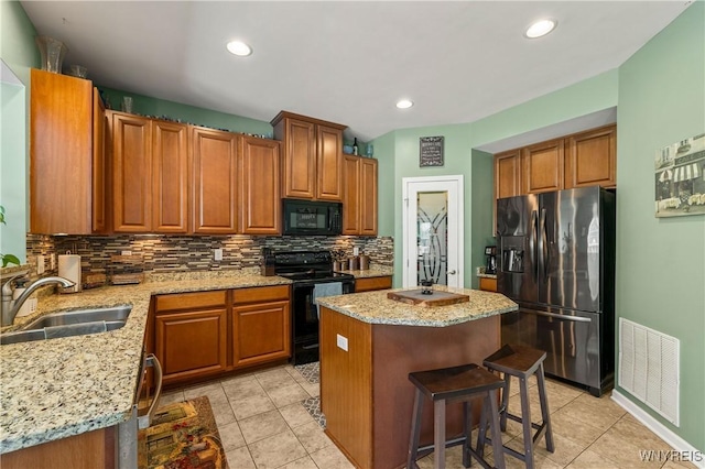 1 Skylark Ln, Wheatfield, NY 14304 - kitchen featuring black appliances, a sink, decorative backsplash, light tile patterned floors, and recessed lighting