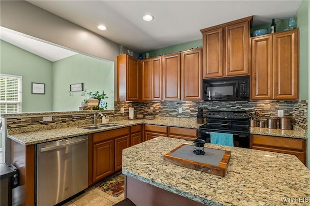 1 Skylark Ln, Wheatfield, NY 14304 - kitchen featuring black appliances, a sink, tasteful backsplash, light stone counters, and recessed lighting