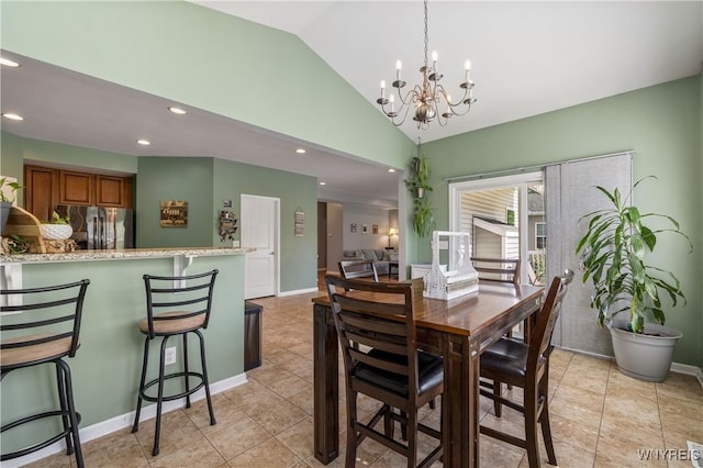 1 Skylark Ln, Wheatfield, NY 14304 - dining space with a chandelier, recessed lighting, vaulted ceiling, light tile patterned floors, and baseboards