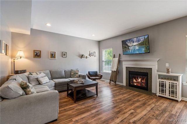 1 Skylark Ln, Wheatfield, NY 14304 - living area featuring wood finished floors, a glass covered fireplace, recessed lighting, and baseboards