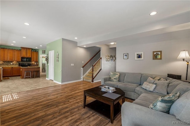 1 Skylark Ln, Wheatfield, NY 14304 - living area with light wood-style flooring, recessed lighting, stairway, and baseboards