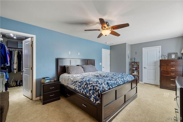 1 Skylark Ln, Wheatfield, NY 14304 - bedroom featuring light colored carpet, a walk in closet, a closet, and ceiling fan