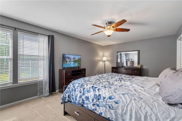 1 Skylark Ln, Wheatfield, NY 14304 - bedroom with multiple windows, light carpet, baseboards, and ceiling fan
