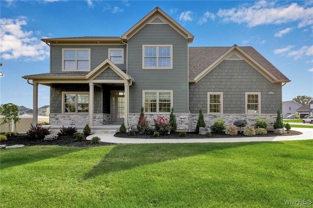 6401 Ward, Wheatfield, NY 14132 - craftsman-style home with stone siding, a front lawn, and covered porch
