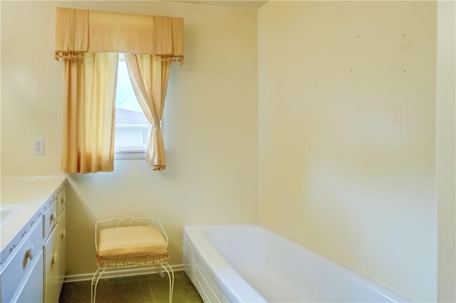 41 Leicestershire Rd, Irondequoit, NY 14621 - bathroom with a tub, vanity, and baseboards