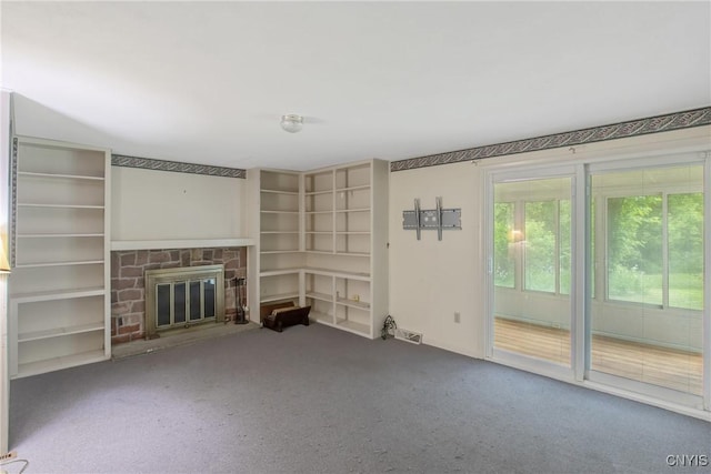 3643 Armstrong Rd, Camillus, NY 13209 - unfurnished living room featuring carpet flooring and a fireplace