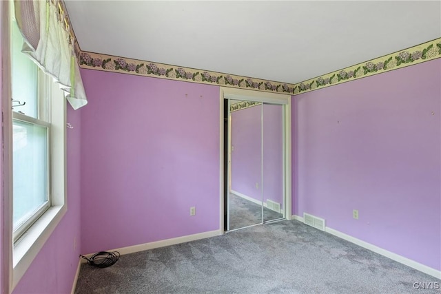 3643 Armstrong Rd, Camillus, NY 13209 - unfurnished bedroom featuring carpet, baseboards, and a closet