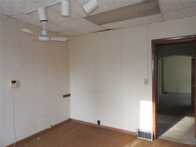 1658 Valley Dr, Syracuse, NY 13207 - unfurnished room with a ceiling fan, carpet, arched walkways, and baseboards