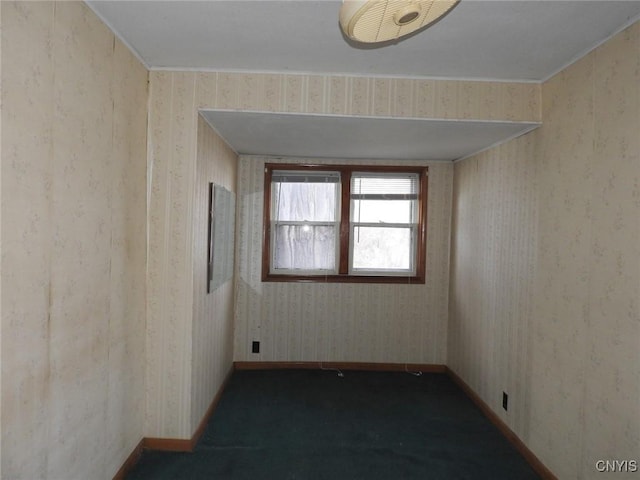 1658 Valley Dr, Syracuse, NY 13207 - empty room with baseboards and dark colored carpet