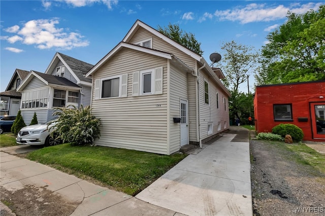 1244 Kenmore Ave, Buffalo, NY 14216 - view of front of house with driveway and a front lawn