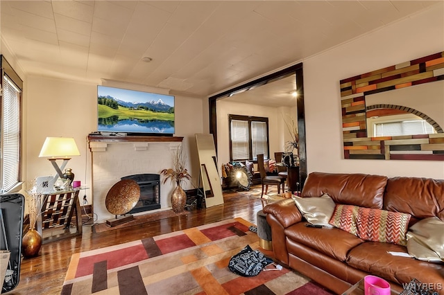 1244 Kenmore Ave, Buffalo, NY 14216 - living area with wood finished floors and a brick fireplace