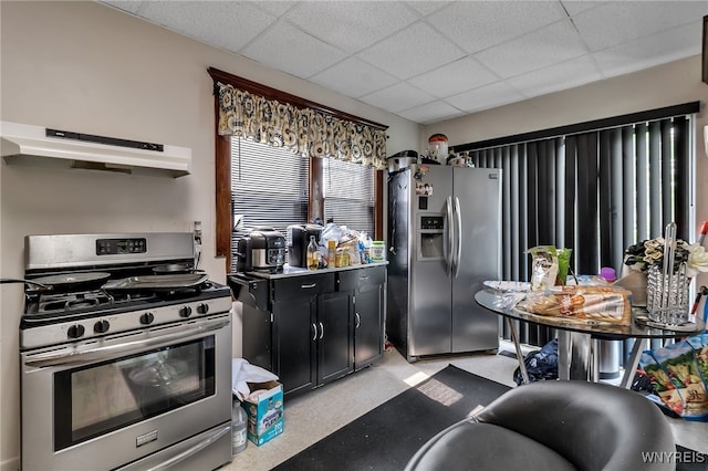 1244 Kenmore Ave, Buffalo, NY 14216 - kitchen featuring appliances with stainless steel finishes, under cabinet range hood, a paneled ceiling, and dark cabinetry