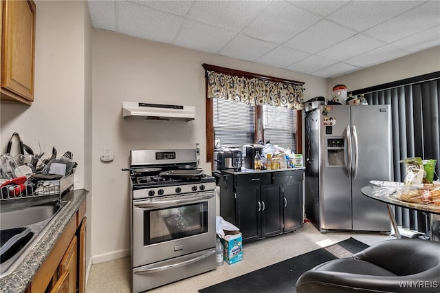 1244 Kenmore Ave, Buffalo, NY 14216 - kitchen with under cabinet range hood, stainless steel appliances, a paneled ceiling, and a sink