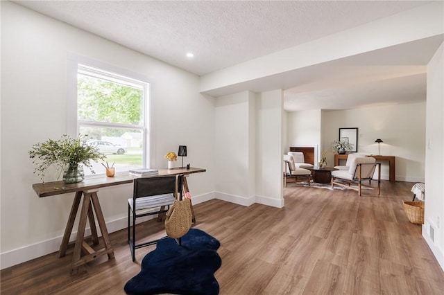 3908 Stalker Rd, Walworth, NY 14502 - home office featuring a textured ceiling, wood finished floors, baseboards, and recessed lighting