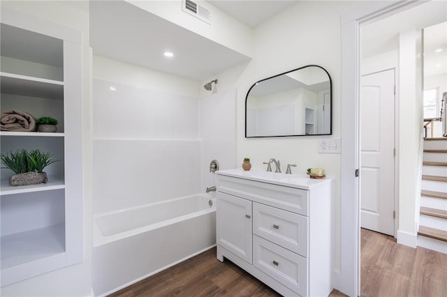 3908 Stalker Rd, Walworth, NY 14502 - bathroom with wood finished floors, vanity, shower / tub combination, and a closet