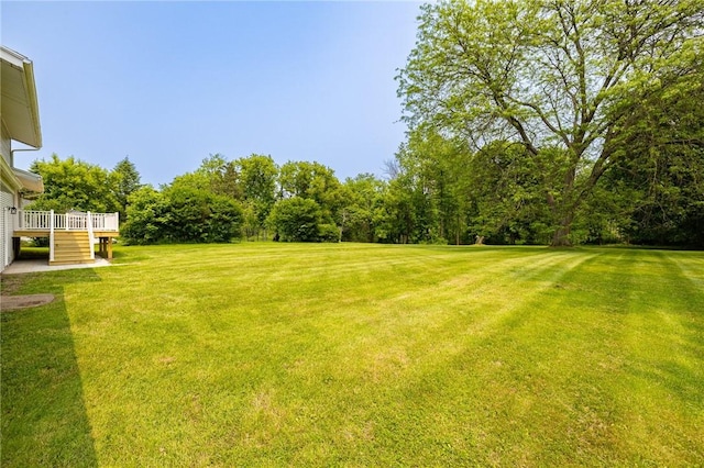 3908 Stalker Rd, Walworth, NY 14502 - view of grassy yard with a deck and stairway