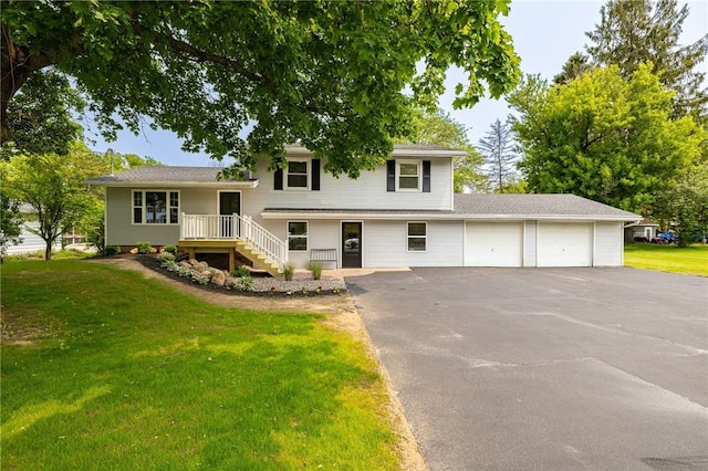 3908 Stalker Rd, Walworth, NY 14502 - tri-level home with an attached garage, asphalt driveway, and a front lawn