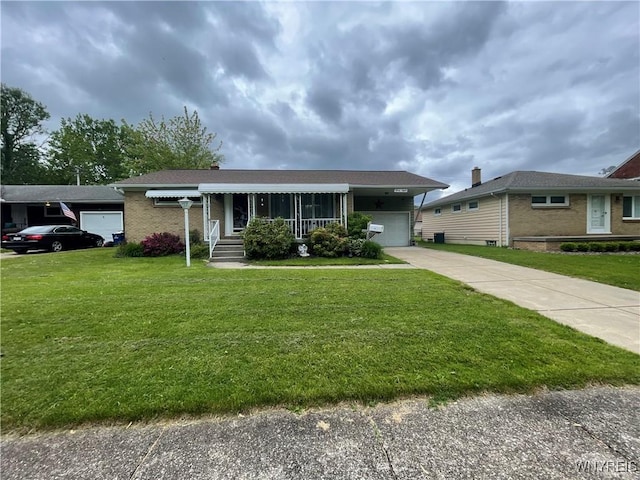 48 Ward Ct, Buffalo, NY 14220 - single story home with brick siding, a front yard, and driveway