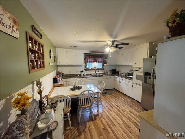 48 Ward Ct, Buffalo, NY 14220 - kitchen with stainless steel refrigerator with ice dispenser, oven, a sink, and light wood-style floors