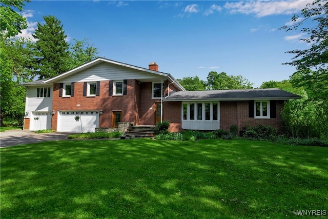 9325 Hunting Valley Rd N, Clarence, NY 14031 - split level home with a chimney, a garage, brick siding, driveway, and a front lawn