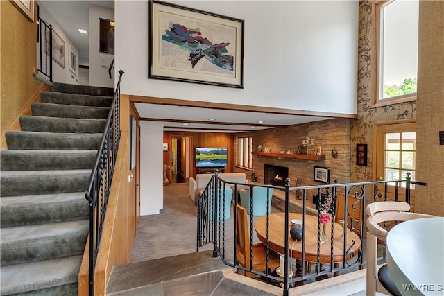 9325 Hunting Valley Rd N, Clarence, NY 14031 - stairway with a brick fireplace